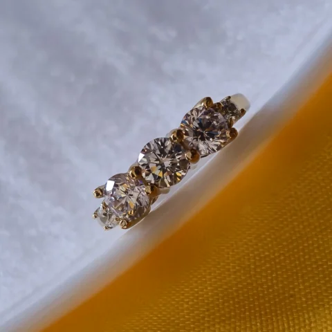 Elegant Three Stone CZ Gold Ring