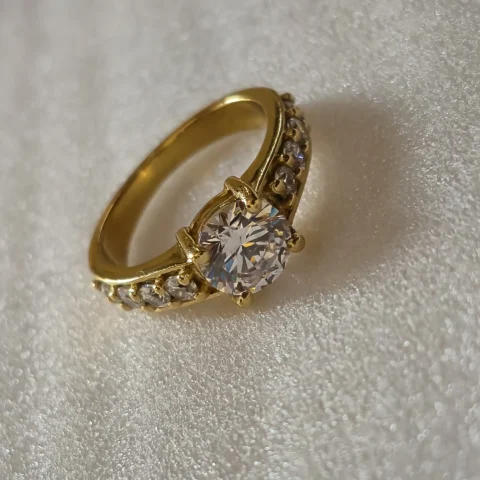 Classic Solitaire CZ Gold Ring with Side Stones