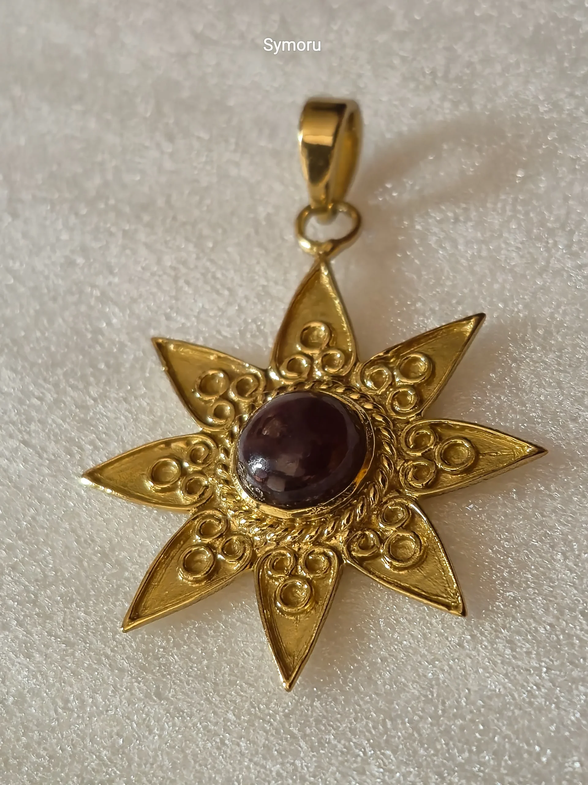 Gold Tone Brass Sun Star Pendant with Maroon Cabochon