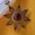 Gold Tone Brass Sun Star Pendant with Maroon Cabochon