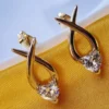 Gold Tone Brass Infinity Loop with Heart Cut CZ Stud Earrings