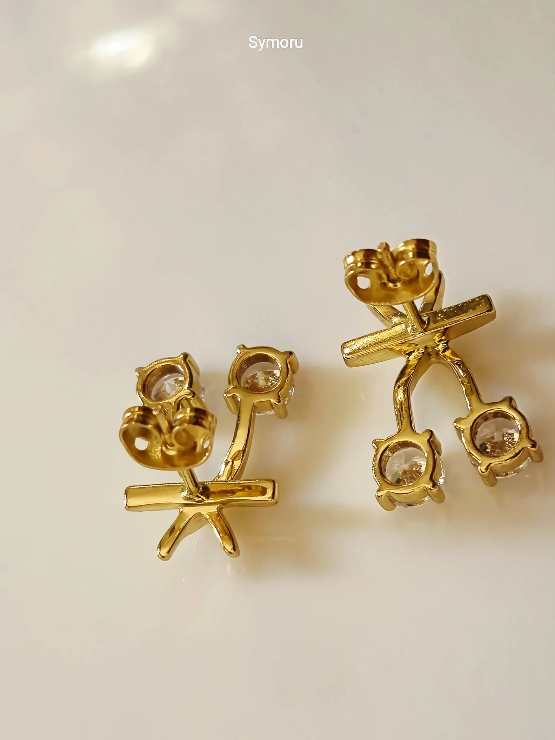 Gold Tone Brass Cross Arc Dual CZ Stud Earrings | Minimalist Diamond Look Curve Earrings for Women | Elegant Daily & Party Wear by Symoru - Image 5