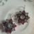 Brass Multi-Stone Floral Drop Earrings with Red & Clear Stones