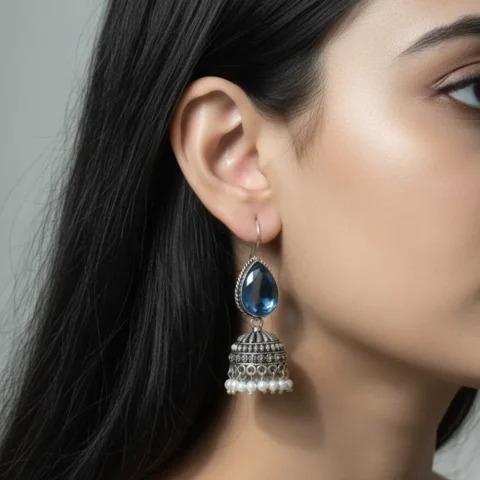 Oxidized Brass Transparent Blue Stone Jhumka Earrings with Pearl Drops